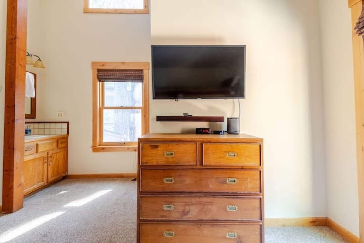 Bunk room TV and dresser.