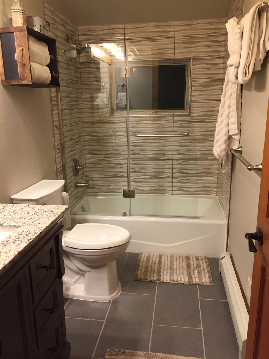 Front bathroom with tub/shower combination.
