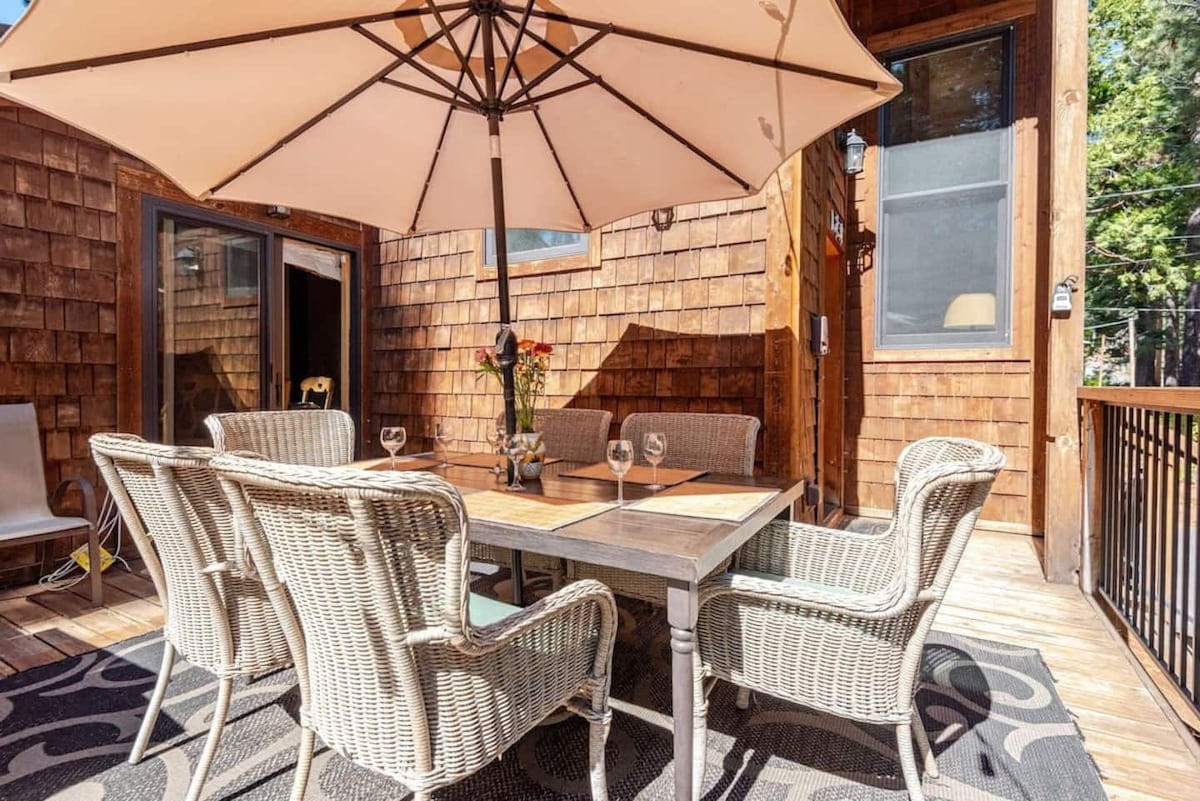 Deck dining area with umbrella seating.